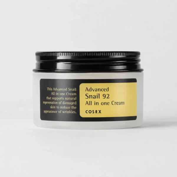cosrx-advanced-snail-92-all-in-one-cream-100ml-real-product-open-jar COSRX Advanced Snail 92 All In One Cream 100ml real product still life with snail cream jar and soft yellow lighting