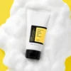 COSRX Advanced Snail Mucin Gel Cleanser 150ml real product commercial shot on foam backdrop with bright skincare styling