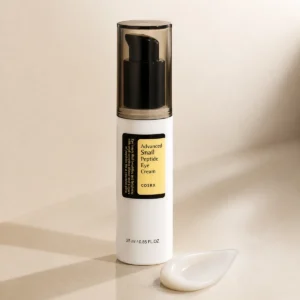 COSRX Advanced Snail Peptide Eye Cream 25ml real product image with cream swatch and minimal skincare styling